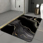 tapis de bain élégant noir et doré